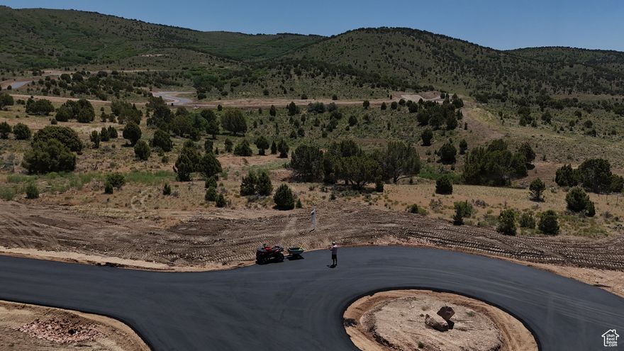 Welcome to The Ridge at Cherry Canyon. A brand new subdivision in Wanship, tucked away up Cherry Canyon. An area most have never seen or discovered. A diamond in the rough is an understatement. Lot 8 is a 1.31 acre lot on the end of a cul de sac with 360 degree views from Park City to the south around to surrounding red rock landscape and juniper pines. Only a 12 minute drive to Kimball junction down I-80 west for ultimate convenience, however you feel like your in peace, seclusion and the good ole days of Summit County. Yes, development in pushing this way, however Cherry Canyon is one way in/out and will have very limited development. Only 30 lots from 1-5 acres! Lot 8 is fully improved with community stubbed well water, community septic system, and underground electricity . What is unique about lot 8 is the ease of a build. Offering plenty of flat area to build a single level or two story above grade, or push the home back where there is a slope that would allow for a walk out basement. Either way, the driveway will be very flay and minimal excavation costs. Newly built homes will be from the high 3 millions and up from there. This is an amazing opportunity!!