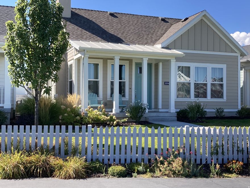 Stunning waterfront home offers unparalleled views of Oquirrh Lake from every angle! Enjoy breathtaking sunrises and vibrant sunsets with effortless Oquirrh Lake access - grab your paddleboard and walk a mere 20 steps to the beach! The inviting family room welcomes you with vaulted ceilings, abundant natural light, and a built-in gas fireplace perfect for cozy evenings or entertaining guests. Luxury vinyl flooring flows seamlessly throughout the main living areas, guiding you into a beautifully appointed kitchen and dining space featuring crisp cabinetry with crown molding, stainless steel appliances, quartz countertops, and a spacious peninsula island. The adjacent dining area accesses a custom patio, ideal for BBQs and seamless indoor-outdoor gatherings. The main-level primary suite is 2' oversized and showcases stunning lake and mountain views, along with a private ensuite bathroom complete with double vanities, quartz tops, crisp cabinetry, a Euro glass shower, and a walk-in closet. There are two additional bedrooms providing versatile options for a home office, fitness room, study/library, or guest suite. Beyond the visible upgrades and finishes, this home is thoughtfully upgraded with a whole-house humidifier, water conditioning system, MERV-11 air filtration, instant hot water, exterior natural gas patio hookup, 6-inch exterior walls for enhanced energy efficiency, upgraded laminate flooring, extra-tall and wide doors, an extended primary suite, extra-wide garage, enclosed water closet, attic power antenna for local stations, and a custom garage man door. The unfinished basement offers excellent room to grow and future customization. Located within Daybreak's sought-after Garden Park 55+ community, residents enjoy exclusive access to clubhouses, pickleball courts, a private 55+ pool, fitness center, chef's kitchen, and more. This is a rare opportunity to own a premier waterfront property in Daybreak, schedule your private tour today!