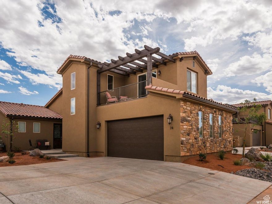 Welcome to Paradise Village! This upgraded, well-maintained home is being sold completely ''Turn Key''! All furnishings and appliances are included for your convenience. This property sleeps 12 and is perfectly situated near all the resort-style amenities, including multiple pools, hot tubs, slides, Southern Utah's first water park, a lazy river, pickleball and volleyball courts, and a clubhouse with a gym, all surrounded by open green space. Inside, the home features an open-concept layout with extended kitchen cabinets to the ceiling, stainless steel appliances, a gas stove, and a large island bar with extra seating. Enjoy a main-level primary suite, with 2 additional bedroom en-suits on the second level, with one room offering a covered balcony with stunning red mountain views, plus an additional half bath off the kitchen for guests. The oversized backyard provides room to add a patio or hot tub, making it an ideal retreat or vacation rental. This property offers the best comfort, style, and location in one of Southern Utah's most desirable communities.