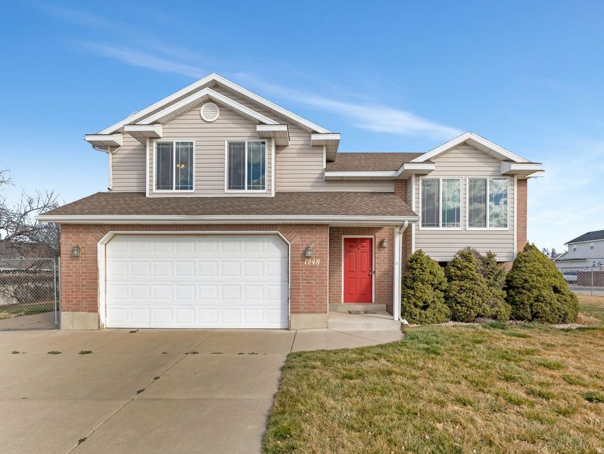 Bright, clean, and move-in ready! This home features abundant natural light, creating a warm and inviting ambiance throughout. The curb appeal is welcoming, drawing the eye to the exterior.  The interior showcases neutral tones, allowing for ease in personalization and flexibility. The tiled and hardwood flooring provides durable and easy-to-clean surfaces. Ample cabinetry ensures plenty of storage space in the kitchen, while the neutral color scheme complements a variety of design styles.  The spacious composite deck provides an ideal outdoor living area perfect for relaxing, allowing all to enjoy the large yard.  You'll appreciate the larger garage, RV parking, and the peace of mind that comes with the big-ticket items already handled. With a new roof (2025), Trex deck (2022), and HVAC (2020), you can move in with confidence and fewer surprise expenses. Located near the Clinton Rail Trail, offering easy access to walking and biking. A great combination of space, updates, and location.