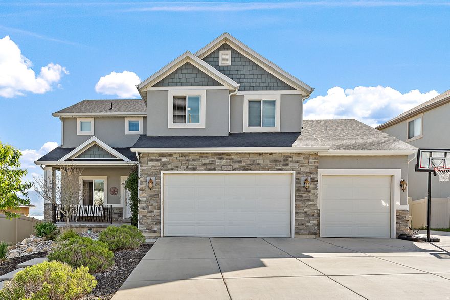 Welcome to this stunning two-story home in Saratoga Springs, perfectly positioned to capture breathtaking views of the lake and surrounding mountains. This spacious 4-bedroom, 3-bath home offers an ideal blend of comfort, style, and functionality. The thoughtfully designed floor plan provides generous living spaces perfect for both everyday living and entertaining. The kitchen features a brand-new gas range still under warranty, making it a dream for home chefs. Plantation shutters on the east-facing windows allow beautiful morning light while adding elegance and energy efficiency. Throughout the home, brand-new ceiling fans enhance comfort and modern appeal. Major mechanical updates bring added peace of mind, including double water heaters replaced just last year, ensuring reliable hot water for years to come. The unfinished basement offers excellent potential, already plumbed for a future bathroom and featuring a walk-out entrance, providing flexibility for additional living space, a rental opportunity, or customized expansion. Step outside to enjoy a fully fenced and professionally landscaped yard, ideal for relaxing, entertaining, or enjoying Utah's incredible scenery. With stunning views, valuable upgrades, and room to grow, this home offers an exceptional opportunity to enjoy life in one of Saratoga Springs' most desirable locations.
