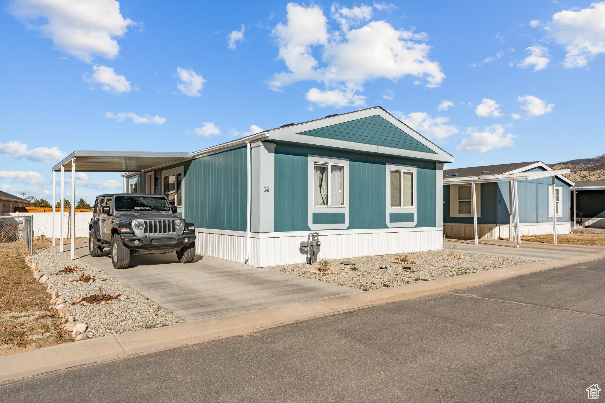 Great Pet Friendly home in Canyon View Manufactured Home Park! This newly remodeled 3-bedroom, 2-bath home features two covered porches and carports on each side. Inside, the kitchen and living room have new lighting fixtures, and the primary bedroom boasts a brand-new window. The property also includes decorative rock along the west side of the driveway/carport, three beautiful rose bushes, and a newly planted aspen tree in the backyard. The roof is just over a year old, and new rain gutters have been installed. The mobile park offers a large open space and is just three minutes from a pickleball court and skate park. Square footage figures are provided as a courtesy estimate only and were obtained from Owner. Buyer is advised to obtain an independent measurement.