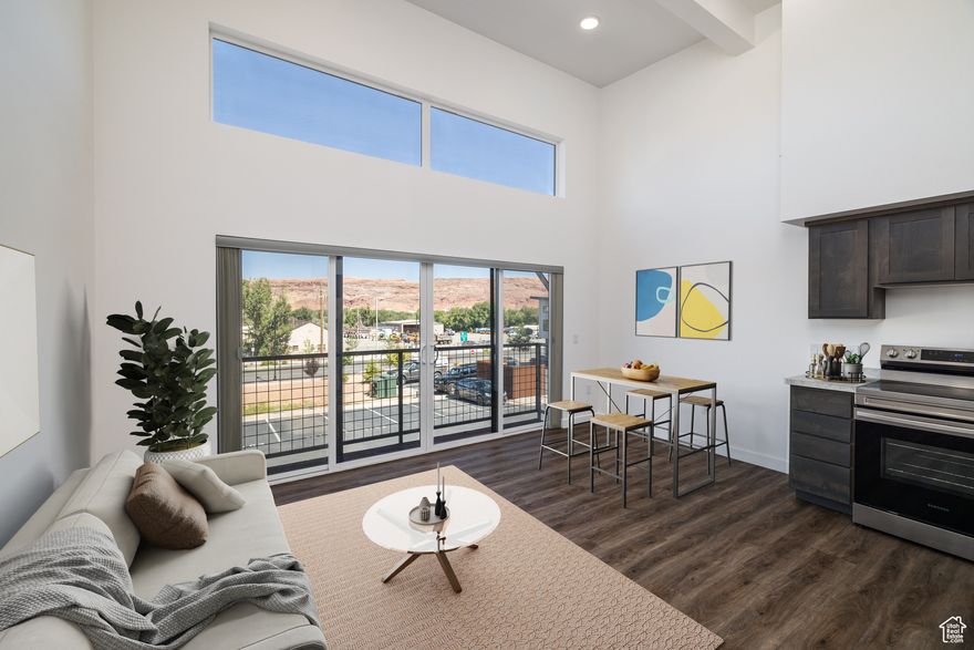 EXCEPTIONAL BALCONY LIVING with long-range views of the La Sal Mountains, Swiss Cheese Ridge, and Arches National Park. This upper-story 1-bedroom, plus flex room, condominium flaunts 11-14 foot ceilings, generating an open and airy space with exceptional wall art opportunities. The flex room is perfect for guest space, a den, yoga studio, or entertainment room. Welcome to the Kane Creek Condominium community, located on the recreational pathway of the beautiful new and improved Kane Creek Boulevard, taking you to Colorado River beaches, quaint canyons, and world-class mountain biking trails such as Amasa Back. A short stroll to downtown Moab and minutes to all that Moab has to offer at the base of the Moab Rim. This condo offers easy, low-maintenance living with common area rooftop decks, green space, independent laundry, and a dedicated parking spot, as well as access to dispersed parking and bike racks. You CAN live and play in Utah's adventure capital!