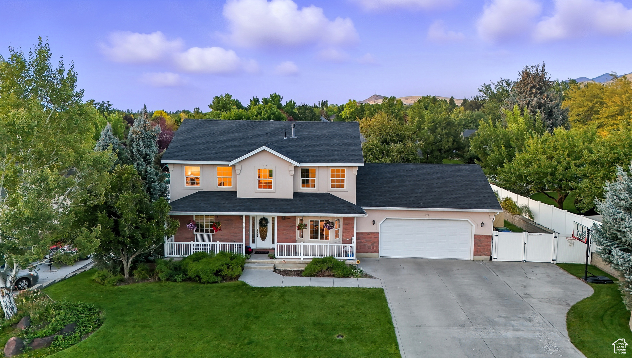 Perfectly positioned to take in breathtaking views of Cache Valley, this home offers 5 bedrooms and 3.5 baths. Step inside to find bright, open living spaces, and a fully finished walkout basement complete with a second kitchen-ideal for guests, multi-generational living, or rental potential. The home sits on a fully landscaped and fenced lot, featuring mature fruit trees, a garden area, and plenty of space to relax or entertain. Enjoy quiet mornings or colorful sunsets from the covered front porch, overlooking expansive valley views. You'll love the convenient location, just minutes from hiking trails, schools, and shopping, yet tucked away in a peaceful community. Key Features: 5 Bedrooms | 3.5 Bathrooms Second Kitchen & Walkout Basement Fully Landscaped & Fenced Yard Fruit Trees & Garden Beautiful Valley & Mountain Views Covered Front Porch Close to Trails, Schools & Stores Don't miss your chance to own this gem in the heart of Smithfield-schedule your showing today!