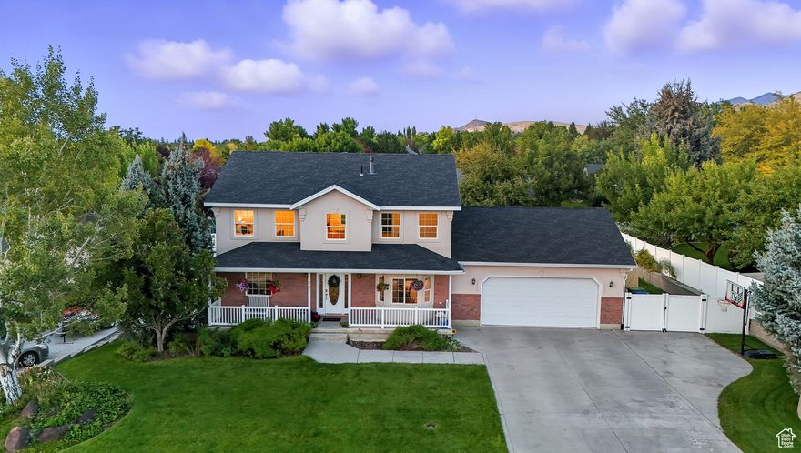 Perfectly positioned to take in breathtaking views of Cache Valley, this home offers 5 bedrooms and 3.5 baths. Step inside to find bright, open living spaces, and a fully finished walkout basement complete with a second kitchen-ideal for guests, multi-generational living, or rental potential. The home sits on a fully landscaped and fenced lot, featuring mature fruit trees, a garden area, and plenty of space to relax or entertain. Enjoy quiet mornings or colorful sunsets from the covered front porch, overlooking expansive valley views. You'll love the convenient location, just minutes from hiking trails, schools, and shopping, yet tucked away in a peaceful community. Key Features: 5 Bedrooms | 3.5 Bathrooms Second Kitchen & Walkout Basement Fully Landscaped & Fenced Yard Fruit Trees & Garden Beautiful Valley & Mountain Views Covered Front Porch Close to Trails, Schools & Stores Don't miss your chance to own this gem in the heart of Smithfield-schedule your showing today!
