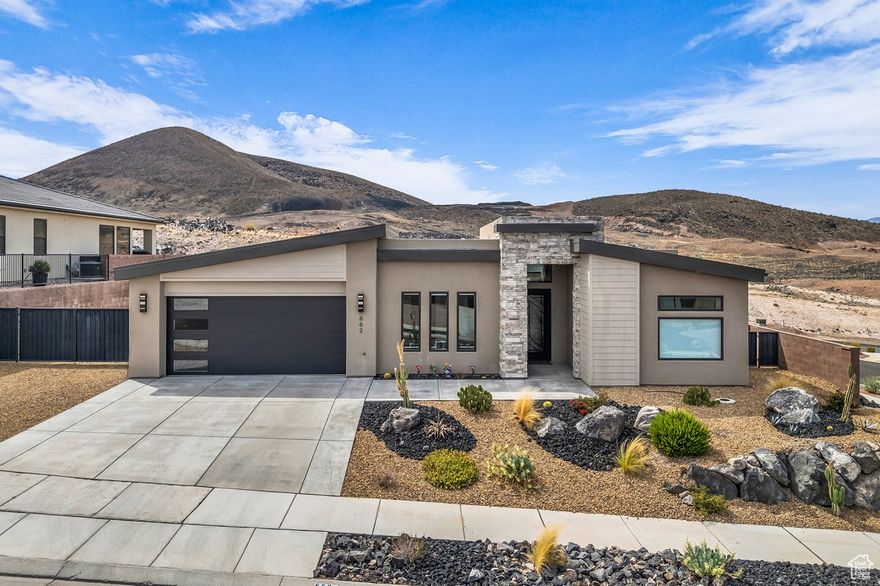 This former builder model home is a showstopper with high-end finishes, perfectly situated on a corner lot with unmatched privacy, a sparkling pool/spa, and a full attached casita. From the living room to the primary suite, the killer 270-degree views of Pine Valley, the red rocks, and even Zion National Park are truly unforgettable. Designer-grade upgrades throughout ensure both style and comfort, starting with an 8-ft metal door entrance and soaring 12-ft ceilings. The gourmet kitchen features Thermador appliances, thick-cut quartz countertops, and a massive hidden walk-in pantry. The primary suite is a true retreat with powered window coverings, a spacious soaker tub, walk-in shower, and a huge master closet. The casita includes its own kitchenette, stackable washer/dryer, and a large walk-in shower, making it perfect for guests or multigenerational living. Outside, the backyard is an entertainer's dream offering a huge, covered patio, pool/spa, and those unbeatable views. The oversized, extra-deep garage could fit 3.5 cars, with additional RV parking and hookups on the side, blending luxury and comfort in one unforgettable package. Buyer to verify all information, deemed reliable, however buyer to verify all info including utilities, rental restrictions, and HOA information if applicable.