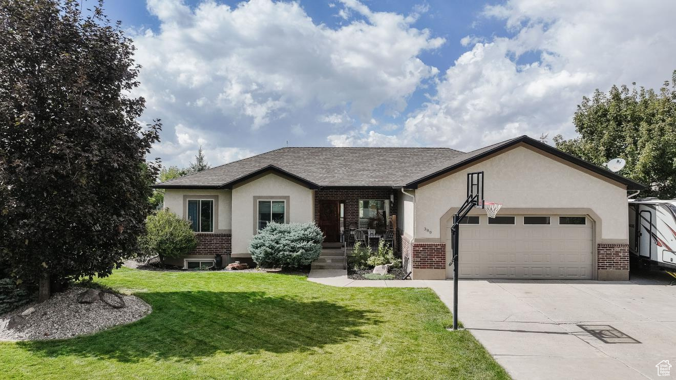 Welcome home to this beautiful stucco and brick property in the heart of Richmond! Featuring 6 bedrooms and 3.5 baths, this spacious home offers gorgeous LVP flooring throughout main level and large windows that let in plenty of natural light. Open kitchen, semi-formal dining area and living space area with laundry room right off of garage with a 1\2 bath make for easy access. Step out onto the main-level deck to soak in breathtaking sunsets, or enjoy the fully fenced backyard that's perfect for gatherings, pets, or play. There is ample storage in the basement for all of your personal items along with a cozy family room downstairs with a walk-out basement onto your patio dining area. This home combines modern comfort with an ideal location-close to everything Richmond has to offer.