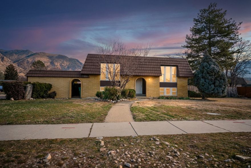 Welcome to this renovated mountain view home at the mouth of Ogden Canyon. With sleek, modern finishes throughout, this light-filled residence offers sweeping mountain views from every angle. The open-concept living area flows seamlessly into a stylish chef-ready kitchen, updated baths throughout and oversized windows frame the stunning scenery. Perfect for entertaining or savoring a tranquil mountain lifestyle with easy access to hiking, biking, and outdoor recreation.