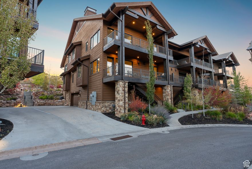 This stunning end-unit 4-bedroom townhome perfectly blends luxury, comfort, and premier ski access via the Frostwood Gondola. Set along the 9th and 10th fairways of the Canyons Golf Course, the home offers breathtaking views of White Pine Canyon from multiple oversized decks across two levels.  Expansive windows and soaring ceilings flood the home with natural light, highlighting its refined mountain contemporary design. The open-concept main level features a chef's kitchen with Thermador appliances, waterfall-edge countertops, and sleek cabinetry, flowing seamlessly into a living room anchored by a modern fireplace. A second living area provides flexibility for a media room, game space, or casual lounge.    The main-level primary suite offers a private sanctuary with its own fireplace, deck access, and a spa-inspired ensuite featuring a soaking tub, dual vanities, warming towel rack and a walk-in shower. On the second level, three additional bedrooms include one with a private ensuite and another featuring expansive windows on two sides that showcase stunning mountain-top views.   Two of the bedrooms share a private oversized balcony, and all bathrooms are beautifully designed with contemporary fixtures, quartz countertops, sleek cabinetry, and double vanities, offering a sophisticated and luxurious experience. A custom bunk room and additional oversized flex space provide comfort and versatility for guests. Automated blackout blinds in all the bedrooms enhances privacy and comfort.   Residents enjoy access to Juniper Landing's premium amenities, including a 25-yard heated saltwater pool, hot tub, dry sauna, steam shower, and fitness center.   Separate membership available to purchase at the Waldorf Astoria, granting access to world-class amenities including ski valet, two-car valet parking, a state-of-the-art fitness center, pool, hot tubs, steam room, and exclusive discounts at the spa and on-site restaurants.  This exceptional year-round mountain home offers two heated single-car garages, each featuring epoxy floors and built-in storage cubbies perfect for four seasons of outdoor gear. A Flo water monitoring and shutoff system provides peace of mind while away from the home, ensuring smart protection in every season. Unexpected, well-designed storage throughout the home adds a rare level of convenience for a townhome.  With its unparalleled access to the Frostwood Gondola, this home offers ski-in, ski-out convenience that truly elevates the mountain living experience.