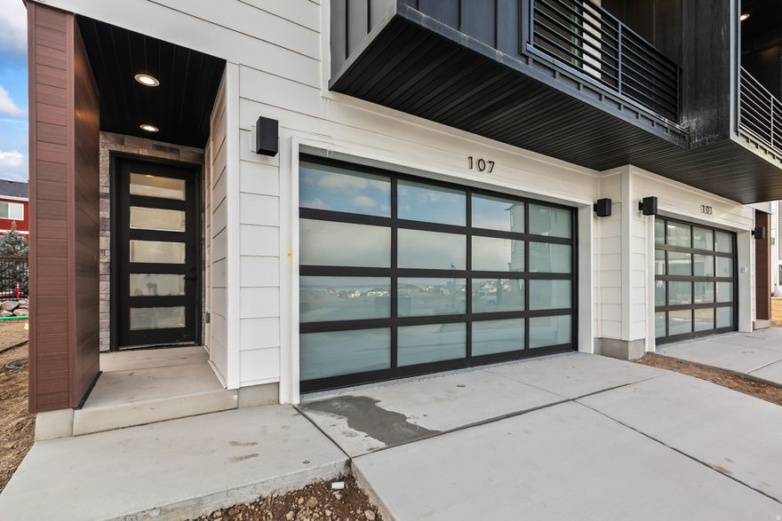 ** The model home is located at 64 Watson Dr. It is open Monday through Friday 11:00 am- 6:00 pm and Saturday from 10:00 am to 5:00 pm. **Experience elevated living in this stunning three-story luxury townhome located on the TalonsCove Golf Course and just moments from Utah Lake. Nestled in a prestigious resort-style community, this home offers the perfect blend of luxury, recreation, and scenic beauty.  The first floor features a versatile space ideal for a home office, guest room, flex area, or bedroom for those wanting to avoid stairs, along with a convenient half bathroom. The second floor showcases a bright open-concept layout with a spacious kitchen, dining, and living area. Floor-to-ceiling windows on both ends fill the space with natural light, creating an inviting and airy environment perfect for entertaining or relaxing.  This exceptional HOA community offers incredible amenities including a year-round natural heated mineral pool fed by local hot springs, a second outdoor swimming pool, two clubhouses with workout facilities and event space, and a private boat dock marina on Utah Lake. Residents also enjoy a large pavilion for hosting gatherings, multiple parks and playgrounds, and miles of connected walking and nature trails throughout the community.  The home itself is filled with premium and thoughtful upgrades including semi-custom soft-close cabinetry, 3 cm quartz kitchen countertops, a vent above the microwave, and high-end window and sliding glass door packages that enhance the home's modern design. The staircase is wider than standard homes and features a large statement window above the stairs that fills the space with light and adds to the luxurious feel.  Additional upgrades include 8-foot doors throughout, custom lighting, extra can lighting with ceiling fan wiring, soundproof walling in the toilet area for added privacy, internet access points installed in the walls, and plumbing for a water softener. The tankless water heater provides efficiency and convenience.  The garage is finished with durable epoxy flooring, an aluminum and glass garage door, added lighting, and a security camera for peace of mind.  Enjoy luxury living just steps from TalonsCove Golf Course and minutes from the water, where resort-style amenities, scenic surroundings, and modern design come together to create an exceptional place to call home.  This is a short sale with an offer currently under review by the lender. No showings available at this time. Please contact agent.