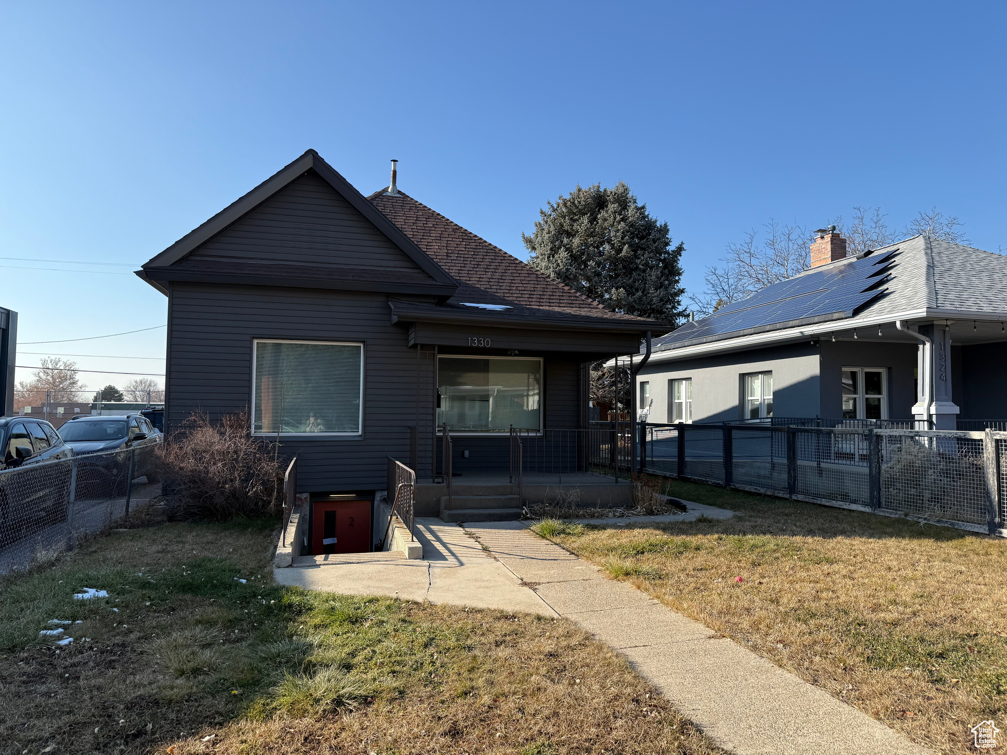 This exceptional mixed-use property presents a unique investment opportunity in a rapidly evolving neighborhood. The upstairs features two distinct spaces: a vacant 300 sq ft unit at the front, currently in "gray shell" condition and ready for customization, ideal for office use in compliance with local zoning regulations. The rear portion houses a fully rented and remodeled two-bedroom, one-bathroom apartment, providing immediate income potential.  The property's versatility extends to the basement, where a separate entrance leads to a recently remodeled apartment, primed for leasing.   Ample parking options, including off-street spaces, two covered spots in the rear garage, and two additional uncovered spaces accessible from the alley.  Situated on 1100 East, the property benefits from the area's ongoing transformation. The neighborhood is witnessing an influx of new businesses and residential developments, creating a vibrant and dynamic community.