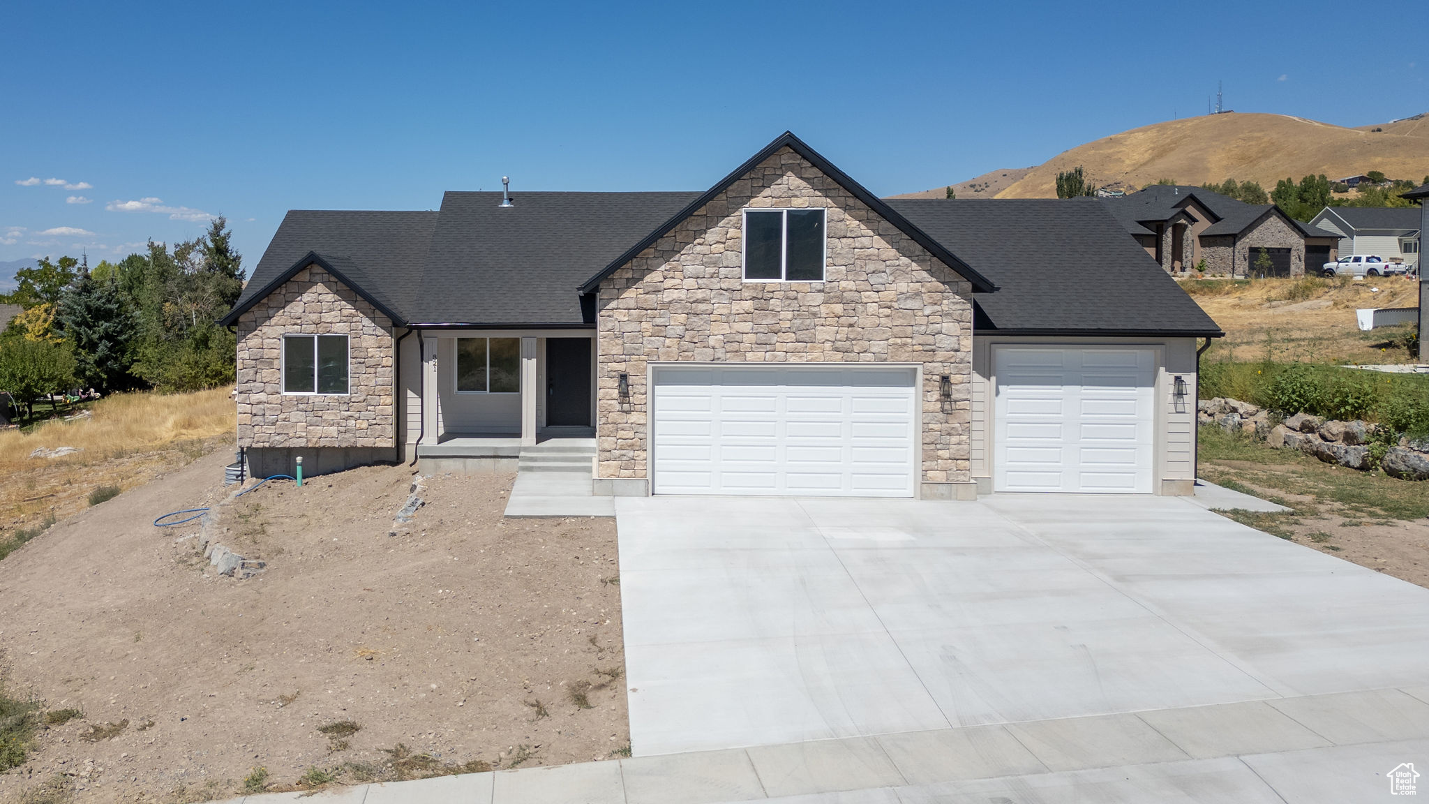 Stunning newly built home located on the east bench offering style, space, and quality craftsmanship throughout. This well designed home features stylish, high-end finishes. LVP flooring, custom wood cabinetry , quartz countertops and modern black metal railings. The kitchen has a walk-in pantry and a convenient pass-through door for groceries to an oversized 3-car garage. 4 finished bedrooms & 2 full bathrooms with plenty of room to grow in the large unfinished basement. Enjoy mountain views from your large, flat lot and relax on the covered back deck. Don't miss your chance to make this beautiful home yours-schedule your showing today! Buyer to verify all information.