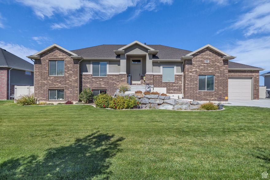 This open concept rambler located in the quiet city of West Point feels like an oasis with its unobscured amazing views, 5 beds, 3 baths, a large basement for entertaining your family and friends or can be used for extra income as a possible rental space with its own separate entrance, full sized kitchen with quartz countertops soft closed cabinets and stainless steel appliances, dining area, large living room, and a full bathroom and bedrooms. The main level living area is bright and open with vaulted ceilings and a stone fireplace. It then opens up to the spacious kitchen with granite countertops, a sizable island, stainless steel appliances, soft closed cabinets, and dining area. The mail level primary bedroom and bathroom suite gives the perfect retreat with vaulted ceilings, walk-in closet, double vanity, and a separate soaking tub and cultured marble shower. This home is truly move in ready and all you could need. The yard is fully landscaped, with fruit trees, a covered patio for entertaining, and plenty of grass area for playing. The convenient location is close to schools, shopping and not far from Ogden Canyon for a quick commute to Snowbasin or Pineview reservoir. Square footage figures are provided as a courtesy estimate only. Buyer is advised to obtain an independent measurement.