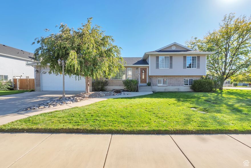 Really wonderful Lehi tri-level on quiet cul-de-sac.  This 6 bedroom, 3.5 bath place is the kind of home that just feels relaxing and welcoming the minute you walk in. Spacious entry, vaulted ceilings, and big kitchen with stainless appliances. Granite counter tops and bamboo floors round out the beauty of the first impression. Laundry on the main floor. Bathrooms remodeled and looking amazing! Furnace and AC less that 1 year old. Roof replaced in 2023. Those are big things to not worry about for a very long time.  Nice trex deck leading out to a huge .37 acre yard that is fully fenced. Detached garage is huge.  Big enough to be able to fit 2 cars and a full out gym space.  Two different spaces that are both heated and cooled. RV parking and garden spot. This place has it all in a country setting, but conveniently close to everything you need.  Come and see today!