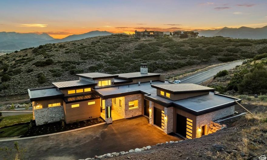 Enhanced Price! New Construction Luxe Mountain Modern in Red Ledges. Architectural masterpiece .Boasting panoramic views of Heber Valley and the iconic Mount Timpanogos. Refined spaces. Statement steel mantel fireplaces. Open floorplan with vast windows connecting to the outside within. Crafted with the finest designer materials and finishes, the home features an open-concept layout with expansive living areas, perfect for both intimate gatherings and grand- entertaining. Large island kitchen with walnut cabinetry and top of the line Thermadore appliances. Designer walk in pantry. Stylish tile flooring. Luxurious hardwood floors. Floating staircase. Stately office. Primary suite with mtn views, private view deck and spa bath. Natural stone countertops. Dream Lower level with high ceilings, entertainers' gathering room with wet bar. Walkout to patios. Three oversized ensuite guestrooms. Red Ledges community of golf courses, family-friendly golf park, tennis and pickleball, active member ski club, equestrian center, clubhouse with restaurant and bar, pool with water slide, lap lanes, and poolside bar. Top-rated amenities. Red Ledges encompasses nearly 2,000 acres of stunning Utah real estate, just 15 minutes To Deer Valley Ski Resort. 20 minutes from Park City. Residents enjoy access to exclusive amenities, including the award-winning Jack Nicklaus Signature Golf Course, the Jim McLean Golf School, and the Cliff Drysdale Tennis School. Lifestyle Membership Available.