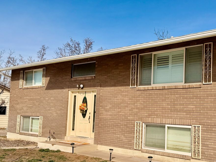 You know you want this one! Stop waiting and get it written up- Rare  0.77 acre property   Ultimate Space for Work, Storage & Hobbies  This versatile property offers an outstanding combination of space, functionality, and location-perfect for contractors, business owners, hobbyists, and anyone needing room to build, store, or create. Conveniently located near parks, schools, shopping, dining, entertainment, and Hill Air Force Base, with access to high-speed fiber internet up to 1 Gig.  At the heart of the property is a massive 4,536 sq ft multi-use building designed for flexibility. Featuring power, an office area, multiple water sources, and expansive open space, it's ideal for a workshop, fabrication area, home-based business, indoor recreation, or large-scale storage. Whether you're running a business, working on projects, or need room for tools and equipment, this space delivers.  A standout 1,600 sq ft covered metal structure with two-story clearance provides exceptional room for RVs, trailers, boats, work vehicles, or heavy equipment-making it a dream setup for contractors, car enthusiasts, or outdoor adventure storage.  The solid brick home is fully finished and offers generous living space with room to grow. Recent upgrades include a newly installed water heater and expansion tank, adding value and peace of mind. Enjoy outdoor living with a covered deck, covered patio, and a charming gazebo-perfect for relaxing or entertaining.  A separate basement entrance adds flexibility for a home office, client-facing workspace, rental potential, or multi-generational living. The attached garage, complete with its own furnace and thermostat, functions as an ideal year-round workshop, project space, or additional storage.  Whether you're a contractor, entrepreneur, car enthusiast, or simply need space for RVs, toys, and projects, this property delivers a rare combination of usability and convenience in a prime Clinton location.