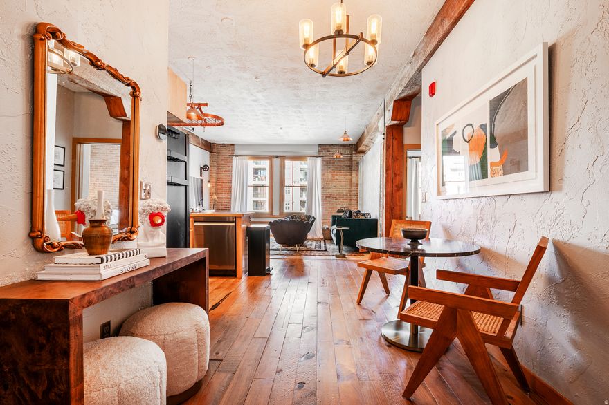 This is one of two beautifully-designed, front-facing units offered for sale by the owner in one of Salt Lake City's most unique loft buildings. A rare opportunity to purchase one loft or both, to combine, creating a large one-of-a-kind space in the heart of the city (with board approval, see MLS 2137216). The pet-friendly Warehouse District condo building is a warehouse-to-condo conversation in the city's lively Gateway District. Just outside the door are some of the city's best restaurants, bars, theaters and shops. Walk to The Rose Establishment for coffee, Caputo's for lunch, or Chile-Tepin for dinner. Floor-to-ceiling exposed brick, large timber beams, and wood windows make this loft feel warm and authentic. This is a corner unit with great light from two sides of the building. Includes a covered parking space inside the secure gate, and in-unit washer & dryer. All this, just 10 minutes from the new Salt Lake International Airport. Truly a must-see property.