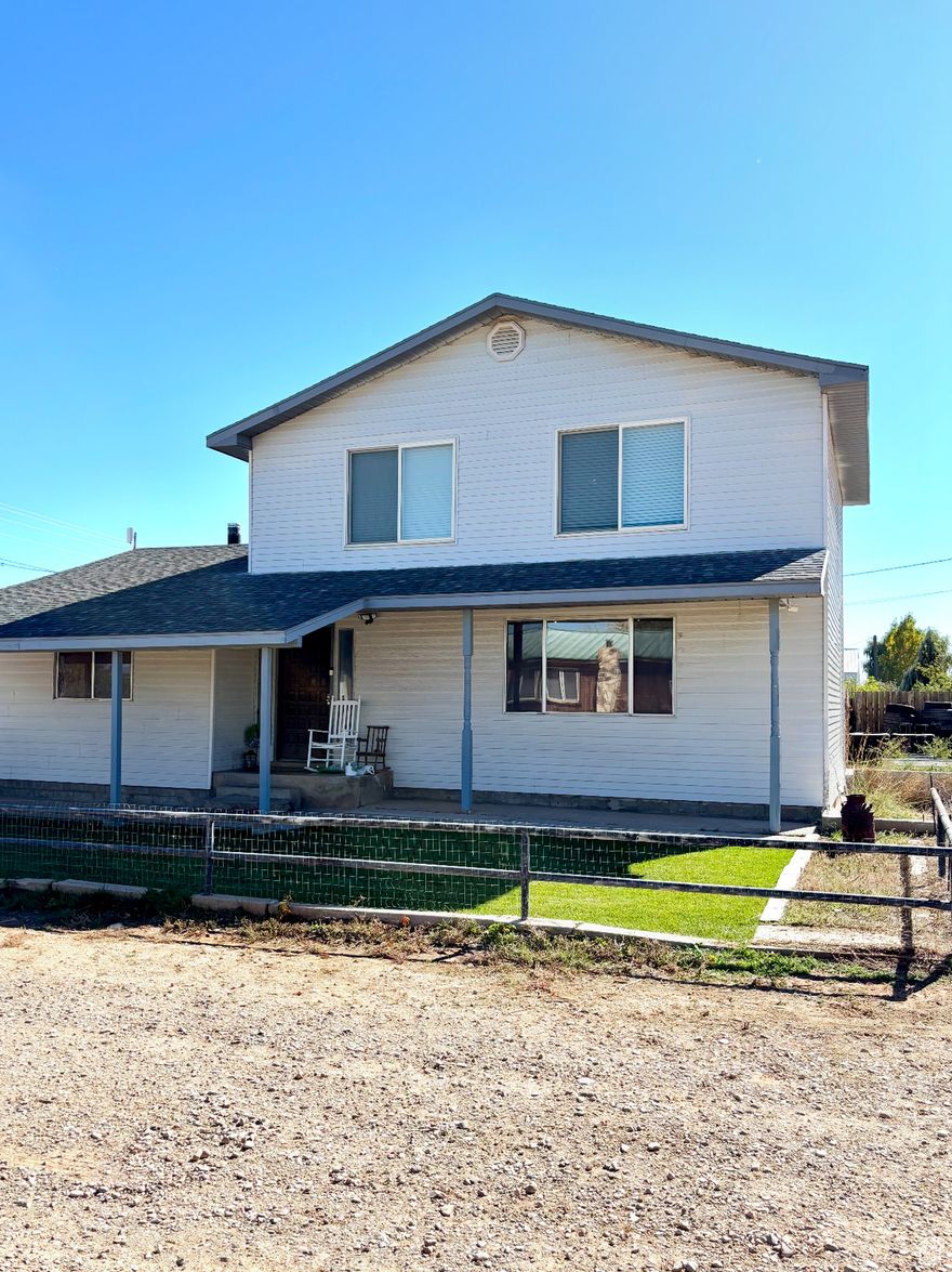 This darling home is in an amazing price range! This home offers a large dining room, a wood burning stove in the family room to keep you nice and cozy in the winter, a large walk in closet, 1.5 bathrooms, and two bedrooms. The upstairs was newly remodeled and is immaculate condition. This home sits on .35  acres, the back yard is fully fenced and it has a carport for storage. A additional foundation was poured to the side of the home for someone to add additional living space if desired! Buyer to verify all information is correct. Call for a showing today!