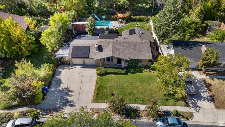 LOCATION, LOCATION, LOCATION! Nestled in a quiet, secluded Taylorsville neighborhood just west of the Jordan Canal, this custom-built 1973 rambler offers timeless craftsmanship combined with thoughtful updates throughout. Enjoy the perfect blend of privacy and convenience - minutes from commuter routes, shopping, restaurants, and Salt Lake Community College, yet tucked away in a peaceful setting that feels worlds apart. Step inside and be impressed by the updated kitchen featuring quality finishes and updated appliances designed for today's lifestyle. The spacious floor plan flows beautifully for entertaining and everyday living that reflect pride of ownership and quality construction rarely found today. Outside, your private yard is a true retreat - relax beside the heated saltwater pool complete with an automatic cover and gas BBQ hookup, ideal for summer gatherings. A large workshop with 220-volt service and EV charging station adds functionality and convenience for hobbyists or professionals. Outbuildings provide ample storage and flexibility for projects or recreation. Don't miss this rare opportunity to own a solid, beautifully maintained home in one of Taylorsville's most desirable locations. Come see why this hidden gem stands out from the rest!