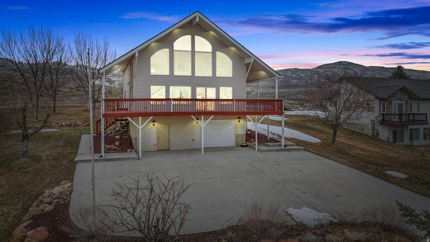 INVESTMENT OPPORTUNITY!!! Perched atop a scenic hillside, this incredible Bear Lake getaway offers breathtaking panoramic views and endless opportunities for relaxation or adventure. The wraparound porch invites you to soak in the lake's beauty while unwinding after a day of outdoor fun. Inside, the two-story vaulted family room showcases floor-to-ceiling windows that frame the lake, creating a bright and picture perfect space for gatherings. The primary suite is a peaceful retreat, featuring an ensuite bathroom complete with a corner soaking tub. Situated on a third of an acre, this property has ample parking for up to twelve vehicles! The outdoor wrap around covered deck and firepit make this the ultimate escape from the city, offering year-round enjoyment.    Located just minutes from Garden City Park, you'll enjoy easy access to a fishing pond, pickleball courts, a baseball field, and miles of walking and biking trails. For outdoor enthusiasts, the area offers boating, fishing, UTV trails, and year-round recreation, including Bear Lake beaches, Beaver Mountain skiing, and snowmobiling in the winter. Additional features include gutter heat strips to prevent ice buildup, an owned propane tank, and dryer hookups for both electric and gas/propane. Don't miss your chance to own this incredible Bear Lake retreat-schedule your private showing today!  Extra Notes: All furniture negotiable. Propane tank owned Dryer electrical, gas/propane hook up gutter heat strip to prevent ice buildup, 2 water heaters and 2 separate water pumps.
