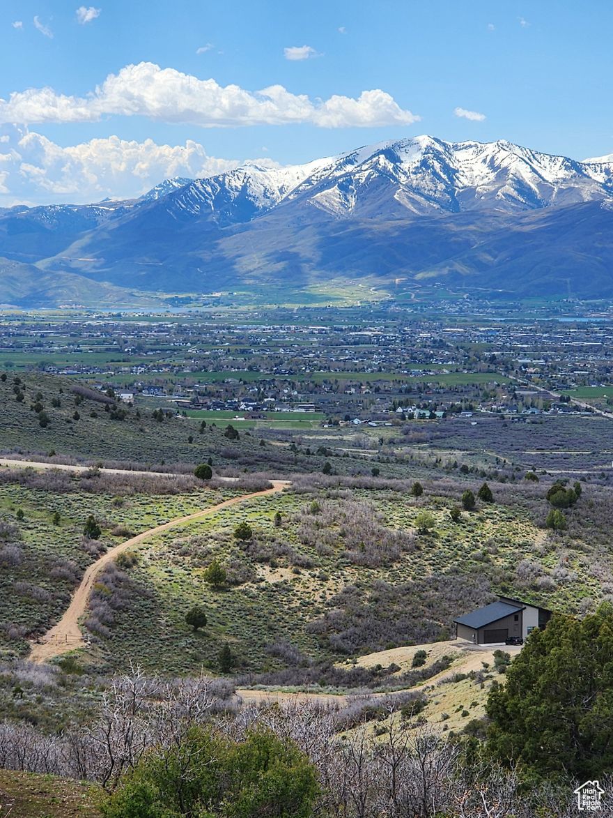 One of the best view lots on the West side.MUST SEE! Imagine mornings filled with the warm glow of sunrise and evenings aglow with the vibrant colors of sunset over the Heber Valley & Mt.Timpanogos. Nestled within the gated mountain community of Timber lakes, this spacious 1+ acre lot offers an extraordinary blank canvas for building your dream home or mountain getaway. The awe-inspiring majesty of Mt. Timpanogos dominates the southern horizon, while Heber Valley's expansive western ridgeline unfolds before you all the way to Deer Creek Reservoir and beyond. The lot itself is conveniently located with access from the main gate. Its unobstructed views provide the ideal footprint for flexible building options  to make your dreams come true.  Perc tested, with power and water at the street.