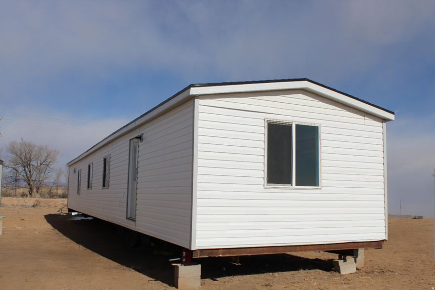 Completely remodeled mobile home, ready to be moved to your desired destination! This home measures 14' by 76' on the exterior and 13' by 75' on the interior. It features an on-demand water heater and a new and modern look with its updated kitchen, flooring, and bathrooms. The seller is willing to negotiate moving the mobile home for the buyer and fixing any repairs needed as a result from the moving process. This home is currently sitting on a steel chassis on the address listed above and NEEDS to be moved off the seller's property, it is being sold as personal property with no land. Buyer is encouraged to verify all information. The amount for the estimated taxes are from the previous owner, who had it in a different location. The current seller does not know 2026 taxes for Uintah County yet.