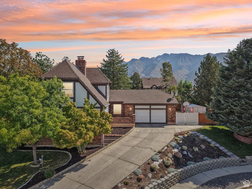 Elevated on a quiet East-Bench cul-de-sac, this 4,140 sq. ft. home offers both city & mountain views in a phenomenal neighborhood-just 10 minutes from Hidden Valley Country Club. Inside, you'll find plenty of space with 6 bedrooms plus a home office and two primary suites: one on the main floor with laundry for true single-level living, plus a second primary suite downstairs. The spacious main-floor living room features an elegant marble fireplace and offers city views, while the large downstairs family room boasts a second fireplace for cozy gatherings. Move-in ready, with tremendous equity potential by completing a few more updates. Outside, you'll enjoy a big backyard with mountain views, garden beds, a firepit, and plenty of RV parking with room to spare for all your toys. See this incredible home today!