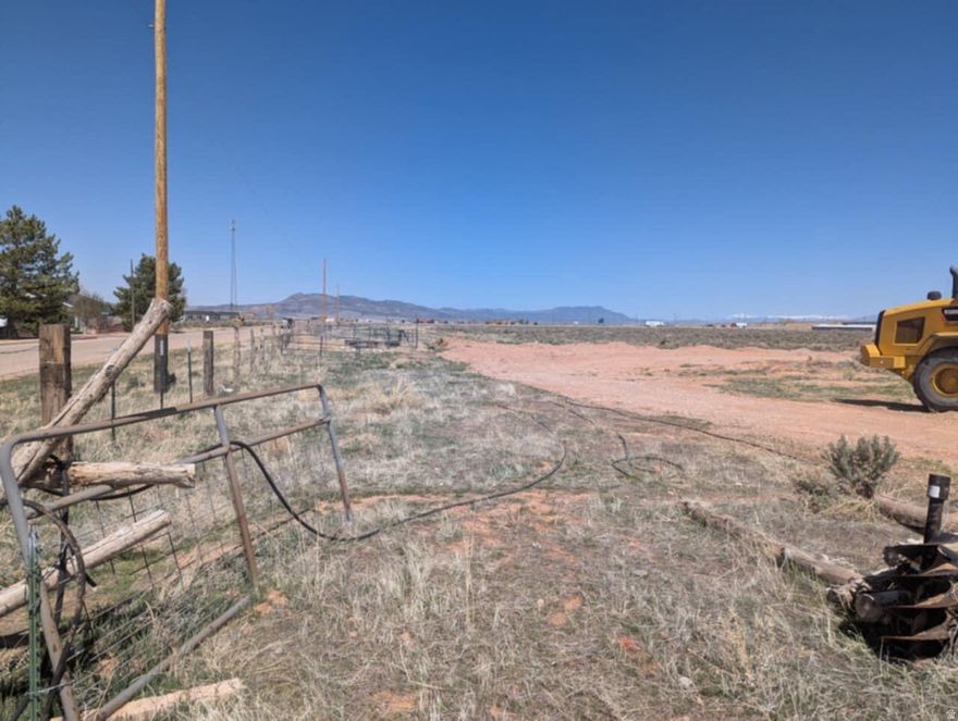Prime Commercial Opportunity off I-15 Exit 75 Interchange! This high-exposure 7.13-acre parcel is strategically located within Parowan's municipal limits, offering a rare "ready-to-go" investment for commercial or residential development. Positioned right off Exit 75, the property boasts incredible visibility and accessibility. Essential utilities-including water, sewer, natural gas, power, and fiber optics-are already available at the forefront of the parcel. The sale includes 1-acre foot of water from Parowan City. Whether you are looking to establish a commercial hub or a strategic residential project, this flat, easily accessible acreage is primed for immediate development. Seize the potential of this growing corridor today!