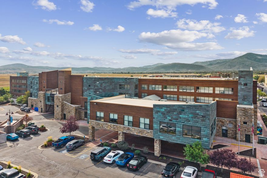Welcome to your mountain retreat in the heart of Kimball Junction! This beautifully appointed 2-bedroom, 2-bathroom Sunbreak floorplan offers 1,156 sq ft of thoughtfully designed space, featuring a flexible lockout bedroom-ideal for rental potential or added privacy. Crafted in a warm Mountain Traditional style, this unit blends comfort and functionality with upscale finishes and generous natural light throughout. Step out onto your private deck and soak in the stunning ski resort views from your own hot tub-perfect after a day on the slopes or trails. Enjoy the full suite of resort-style amenities including a year-round pool, sauna, steam room, and pet-friendly accommodations. The unbeatable location puts you just steps from the vibrant shops, dining, and entertainment options of Kimball Junction, with world-class skiing, hiking, and biking minutes away. Whether you're looking for a personal getaway, an investment property, or both-this Newpark condo offers the perfect combination of lifestyle and flexibility.