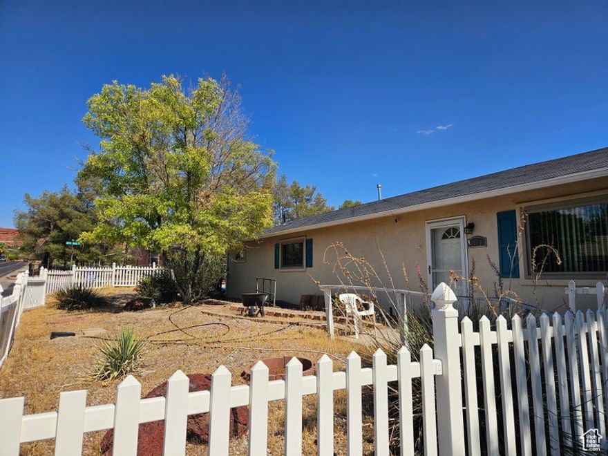 Seller will contribute up to 3% of purchase price towards buyers closing cost with the right offer. This stick-built home, nestled on a .16-acre corner lot, is brimming with potential and ready for your personal touch! Featuring 3  bedrooms and 2 full bathrooms, also includes 200 sq ft finished outbuilding. The kitchen boasts newer appliances, including a gas range and tile floors. It presents a great opportunity for customization.  Key updates include new windows throughout and new entry doors - warranty transfers, ensuring improved energy efficiency and curb appeal. The cozy fireplace in the living room offers the perfect spot for relaxation and gatherings.  Additional features include an oversized garage with plenty of space for storage.