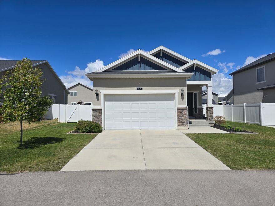 Move-In Ready home in the lovely Ivory Homes Overland neighborhood which has a mix of homes from the high $400k to over $1M! Get into this amazing neighborhood with all it's amenities at an affordable price! Home has a fully finished daylight basement; all stainless appliances including refrigerator, built-in microwave, gas range, dishwasher; white cabinetry & oil rubbed bronze hardware & fixtures; lots of LED can lighting; waterproof laminate flooring family/dining/kitchen floors as well as marble look LVP bathroom floors; ethernet wired to all rooms; huge walk-in closet; custom shelving & woodwork; high efficiency furnace/AC/water heater; 10ft and vaulted ceilings on main level and 9ft ceilings basement; hanging storage shelving in garage; owned 9-panel/1.8kw solar system w/bird guard mesh results in $20-$40 monthly electric bills ($30/avg); composite no maintenance decking; fully fenced backyard with french drain, garden planters along back fence and an 8x8 shed included; refrigerator, washer, dryer and trampoline can all be included with a great offer! Plenty of space on either side of home if you wanted create trailer/RV parking. This home is on the same street as the community pool, playground with zipline, clubhouse/barn and is just 7-8 homes away making it a quick and easy walk! Community also has a bike pump track, pickleball courts and more! It's also located just a few blocks south of the elementary school and a few blocks north of the Jr High and less than 2 miles north of Cedar Valley high school. Its also a quick bike ride along city paths to shopping, eateries and to the Hidden Hollow mountain bike trails which have 100s of miles of trails. One of the best values in Eagle Mtn, come see it and fall in love!