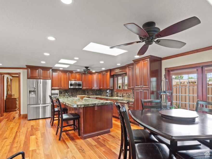 Your Forever Home Awaits in Cottonwood Heights! Step past this unassuming exterior and prepare to be amazed-this home is a true hidden gem. Every detail has been thoughtfully designed for comfort, beauty, and lasting quality. The open great room welcomes you with stunning Brazilian tigerwood floors, elegant European-carved fireplace mantel, rich cherrywood doors, shutters, and cabinetry. The spacious main-floor primary suite offers direct access to a peaceful rear patio-perfect for quiet mornings or evening relaxation. The kitchen and bathrooms feature soft-close cabinets and drawers, Viking appliances, and generous storage throughout, including custom cabinetry in the basement and laundry room. A convenient main-floor laundry and bonus room add even more livability to this beautifully updated home. Enjoy breathtaking mountain views in one of Cottonwood Heights' most desirable neighborhoods, just below Big Cottonwood Canyon. You'll love the easy access to the interstate, airport, top-rated healthcare, fitness centers, shopping, parks, and Utah's world-class ski resorts and hiking trails. This home offers elegance, functionality, and location all in one-truly the perfect place to plant roots and make lasting memories.