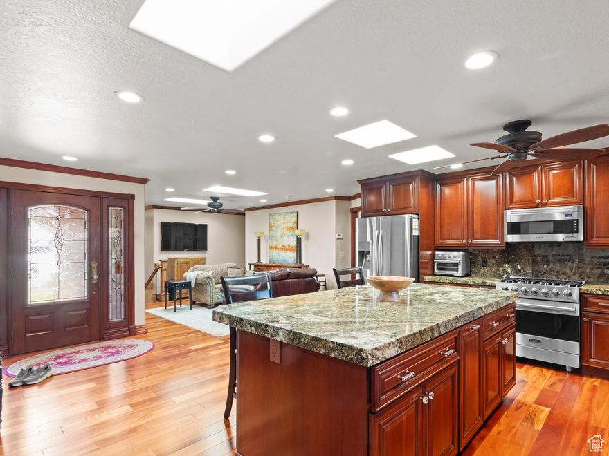 NEW PRICE IMPROVEMENT! This Cottonwood Heights hidden gem is now more accessible than ever. Don't let the modest exterior fool you-inside lies a masterclass in custom craftsmanship. From the Brazilian Tigerwood floors to the hand-carved European mantel and rich cherrywood cabinetry, every inch radiates quality. The main-floor primary suite opens directly to a serene patio, while high-end Viking appliances anchor a kitchen built for entertaining. It's a WOW interior that you must see to appreciate.  Perfectly positioned near the base of Big Cottonwood Canyon, you're minutes from world-class skiing and hiking. Exceptional luxury at a newly adjusted price-this is the value you've been waiting for.