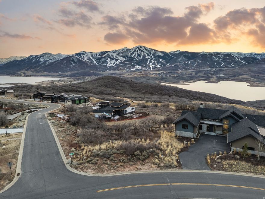 Flat Lot with Unobstructed Views of Jordanelle and Deer Valley!    0.55-acre flat homesite on Lasso Trail in Hideout with direct views of Deer Valley East Village ski runs and the Jordanelle Reservoir. Located in an established neighborhood surrounded by custom homes, this lot offers a build-friendly setting just minutes from Deer Valley East Village, Jordanelle recreation, and a short drive to Park City. Utilities are stubbed to the lot, providing a convenient starting point for your build. The combination of ski and reservoir views, flat topography, and proximity to East Village makes this a compelling opportunity for a primary residence or mountain retreat.