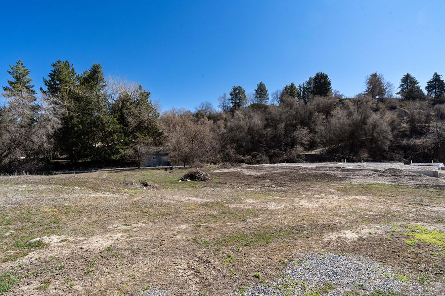 Once in a blue moon a lot comes along that is so special you'd be crazy not to check it out. With over 300' of private frontage on Summit Creek this is the most exclusive lot on the market. Sit and listen to the gentle babble of the water year round, go birding from the sanctuary of your own land, or fish for trout in the glistening stream. The location can't be beat as the lot sits at the intersection of a dead end road and a small quiet loop. Mack Park is a stones throw away and being right off Canyon Road allows you to be at national forest and trails in less than 5 minutes. With over an acre you have room for just about anything you want! Do you have a larger home footprint than fits on a standard lot? No problem! Enjoy a spacious backyard, firepit, pets, place to roam, privacy and peace and quiet, space for a shop, gardening, or simply room to stretch that is minutes from downtown? Then this lot is for you!