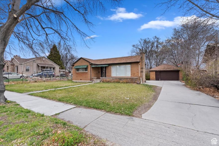 Classic all-brick rambler in the heart of American Fork on a spacious 0.31-acre lot! This well-kept home features a bright, updated kitchen with granite countertops, gas range, and open flow to the living area. The main floor offers two bedrooms and a full bath, with an additional 646 sq ft finished basement that includes two more bedrooms and generous storage space. Enjoy mature trees, mountain views, and a private, fenced yard-perfect for gatherings or gardening. Detached garage with extra parking, full landscaping with automatic sprinklers, and excellent walkability to schools, parks, and downtown amenities. Move-in ready with classic charm and modern convenience!