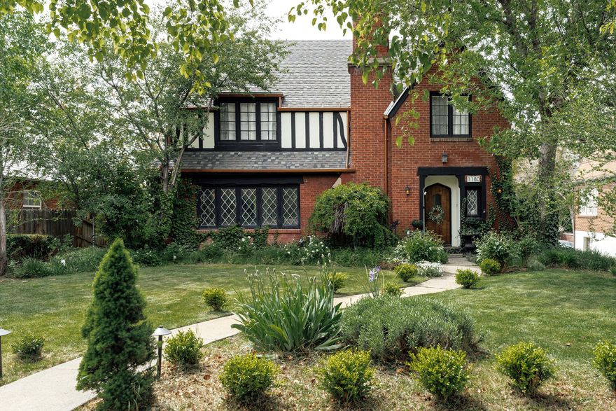 Set within the heart of Harvard/Yale, this beautifully updated 1926 Tudor feels especially magical in spring-when sunlight pours through the leaded glass windows, mature trees begin to bloom, and the backyard becomes an extension of the home itself. Rich original woodwork, graceful architectural lines, handmade tile details, and curated lighting create a warmth that feels both timeless and inviting, while thoughtful modern updates bring comfort and ease to everyday living. Inside, the home offers more than 4,000 square feet with five bedrooms, four bathrooms, and spaces designed for both gathering and retreat. The beautifully reimagined primary suite feels serene and spacious, complete with a large walk-in closet and updated ensuite bath-an uncommon luxury in a Tudor of this era. Downstairs, the fully finished walkout lower level includes two additional bedrooms, a full bath, and a second kitchen, creating flexibility for guests, multigenerational living, or income potential. Out back, the rare flat backyard unfolds like a private sanctuary in the city. A custom outdoor fireplace anchors the patio for cozy evenings under caf lights, while a charming fountain draws birds in and adds a quiet sense of calm. There's room to garden, gather, dine, and simply enjoy the beauty of the season. Above the detached two-car garage, a stunning vaulted finished space currently serves as a light-filled office but could easily become a studio, guest retreat, creative space, or future ADU. Located just moments from East High, beloved neighborhood cafs, 15th and 15th, and downtown Salt Lake, this home offers the rare combination of historic character, modern functionality, and one of the city's most treasured neighborhoods. Because homes like this are about more than architecture alone-they're about the life unfolding within them. Spring dinners on the patio. Windows open to the breeze. Gatherings around the fire. And the enduring beauty of a home that has been thoughtfully loved for nearly a century.