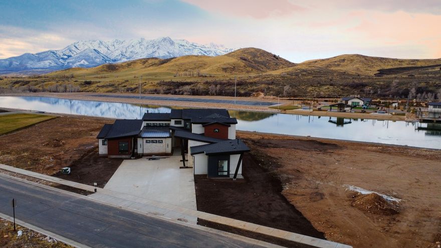 **Price update removes the exterior landscaping, pool, and cabana with exterior kitchen** Under Construction within the Northside Creek recreation-based residential community in picturesque Mountain Green, UT. Experience your new, custom home as a combination lake house, ski chalet, and matchless mountain retreat. Northside Creek Ski Lakes has three distinctive ski lakes on the property and provides endless hours of water-filled fun: Ski Lake, Cable Lake & Adventure Lake.