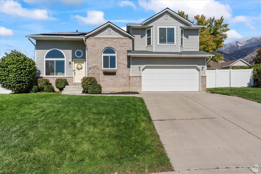 Welcome home to this bright and inviting 5-bedroom, 4-bath residence tucked away on a quiet cul-de-sac with beautiful views in the desirable Pleasant Grove neighborhood. The spacious primary suite offers a walk-in closet and a relaxing jetted tub, while two private guest suites each feature full bathrooms for added comfort and convenience. Separate basement entrance may be perfect for a MIL apartment! Recent upgrades include a brand-new roof, a water softener less than a year old, new PEX piping throughout, double-paned windows installed three years ago, and epoxy-coated garage floors. Energy-efficient solar panels help significantly reduce utility costs, while the well-kept yard,  deck, and fully fenced outdoor space make it perfect for both relaxing and entertaining. Conveniently located near the Murdock Canal Trail and Pleasant Grove High School, this home combines comfort, style, and an unbeatable location-don't miss your chance to make it yours!