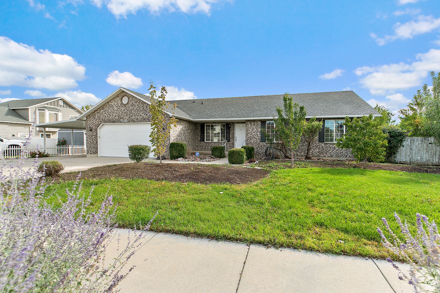 THIS WONDERFUL  LARGE RAMBLER SITS IN THE MIDDLE OF WEST  JORDAN ON A QUIET, SLEEPY CUL-DE-SAC . The main floor has a formal living room, a large great room with vaulted ceilings, large kitchen, and walk-in pantry. Its own laundry room with a built-in ironing board. Large Master bedroom with a master bathroom and large walk-in closet. Two other bedrooms with a full bathroom.  Off of the dining room a large deck in the backyard. Oversized two-car garage.  The basement has its own outside entrance with a full 3-bedroom apartment, large living room with dining area, kitchen, laundry room with washer and dryer, half bathroom, and a full bathroom.  It has its own water heater, abundant storage in a mechanical room, under the stairs and under the front porch. It has two parking spaces, one of which is covered. The basement is a legitimate ADU so you can bring in around $2,000 to $3,000 on rent each month.   The back yard is fully fenced with a gate on each side to go into the front yard, evening shade. Also a chicken coop and a garden area on the south side, mature fruit trees.   In recent years the roof was redone and has paid off solar panels on it that receives a small credit each month. Both kitchens, dishwashers, microwaves, upstairs windows and both water heaters have been replaced.    Conveniently located by Bangerter Hwy, Jordan Landing with plenty of shopping and entertainment, but far away for a peaceful existence.