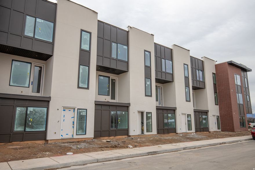 Experience modern, low-maintenance living at theMonroe, a thoughtfully designed townhome community in Salt Lake City's desirable Millcreek neighborhood. This Type C interior unit offers approximately 1,533 sq ft with 2 bedrooms and 2.5 bathrooms across three well-designed levels. The open-concept main floor features a stylish kitchen, dining, and living area that opens to a private balcony, ideal for everyday living or entertaining. Designer-curated finishes include 9' ceilings, quartz countertops, 42" upper cabinets, LVT flooring in main living areas, stainless steel appliances, and included washer, dryer, and refrigerator. The home also features an attached 2-car garage and flexible entry-level space. Community amenities include pickleball courts, a playground, a gathering center, and a dog park, offering both recreation and connection. Conveniently located near shopping, dining, TRAX/light rail, and major commuter routes. Schedule your tour today and discover refined townhome living at theMonroe.