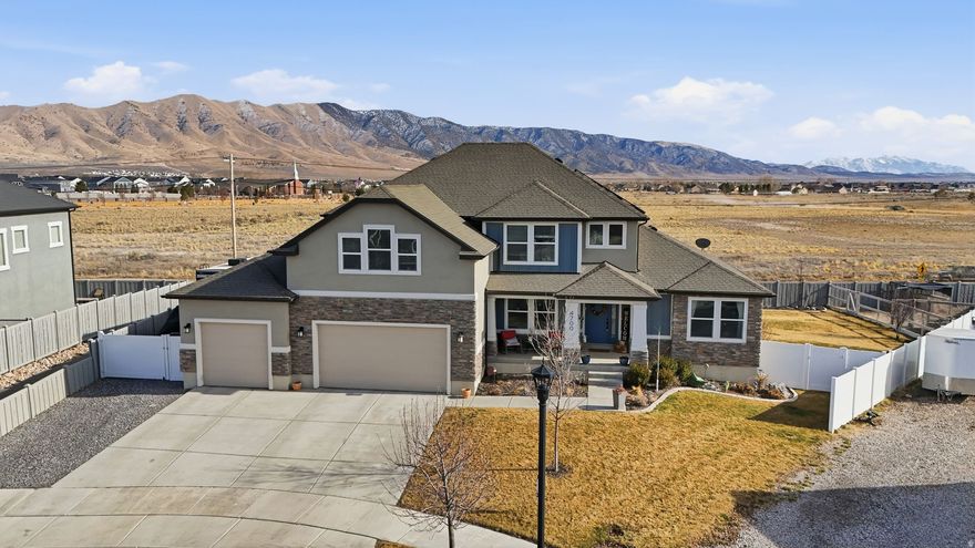 Located in the highly desirable Brandon Park community of Eagle Mountain, this beautiful home offers country-style setting while remaining just minutes from shopping, schools and everyday conveniences-with no HOA. The open main living area features soaring vaulted ceilings and impressive floor to ceiling windows that fill the space with natural light. A spacious kitchen includes  a large island, quartz countertops, upgraded appliances and plenty of storage. The finished basement offers flexibility with a mother in law apartment with separate entrance, complete with kitchen, living room, laundry, bedroom and bath. Perfect for multigenerational living or guests.  A sixth bedroom is already framed, allowing for easy expansion. Enjoy the fantastic backyard with pergola and lush landscaping along with RV parking on the side.