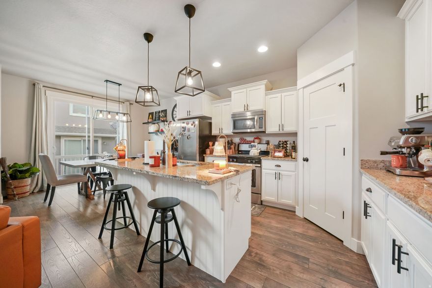 Bright, Spacious, and Perfectly Located!     Step into this stunning Herriman townhouse featuring vaulted ceilings, expansive windows, and abundant natural light that make every room feel open and inviting. With over 2,300 sq. ft. of living space, there's plenty of room to grow with your family. Enjoy a modern kitchen with granite countertops, a private master suite oasis, and a fully landscaped patio for relaxing evenings. Nestled near exclusive restaurants and highend shopping, this home offers both convenience and luxury. HOA amenities include a clubhouse, gym, playground, and pool-everything you need for an elevated lifestyle.