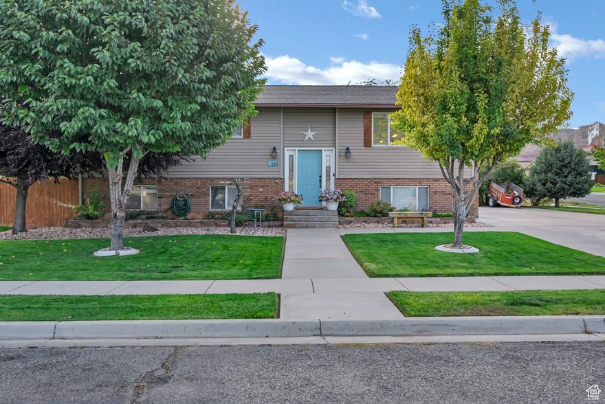 Stunning 5-Bedroom, 3-Bath Home in a desirable neighborhood!  Beautifully landscaped and thoughtfully updated, this spacious home offers everything a buyer seeks. Nestled in a gorgeous, family-friendly neighborhood just a block from the high school, this property combines curb appeal with practical comfort. The home has five bedrooms & three baths for flexible living and guest accommodations, an updated kitchen with modern finishes and ample storage, two cozy fireplaces perfect for winter gatherings, abundant natural light throughout the home, fruit trees in a lush, landscaped yard , a playset for family fun and outdoor entertainment, a patio in the back for relaxing evenings with a fully fenced, secluded yard providing privacy and security! Come see for yourself how perfectly this will fit your family!