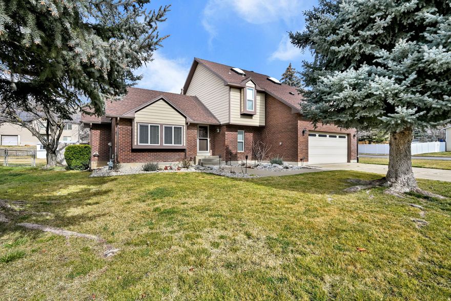 Less than 10 minutes to the South Gate of Hill AFB, this south-facing home offers mountain views in a quiet neighborhood with convenient access to Hwy 89 and I-15. The open floor plan features skylights for added natural light and new windows throughout (2022), contributing to low utility costs. The primary bedroom includes a large walk-in closet and private deck, while the backyard offers a spacious patio ideal for outdoor use. A well-located home with a functional layout and easy commuting access.