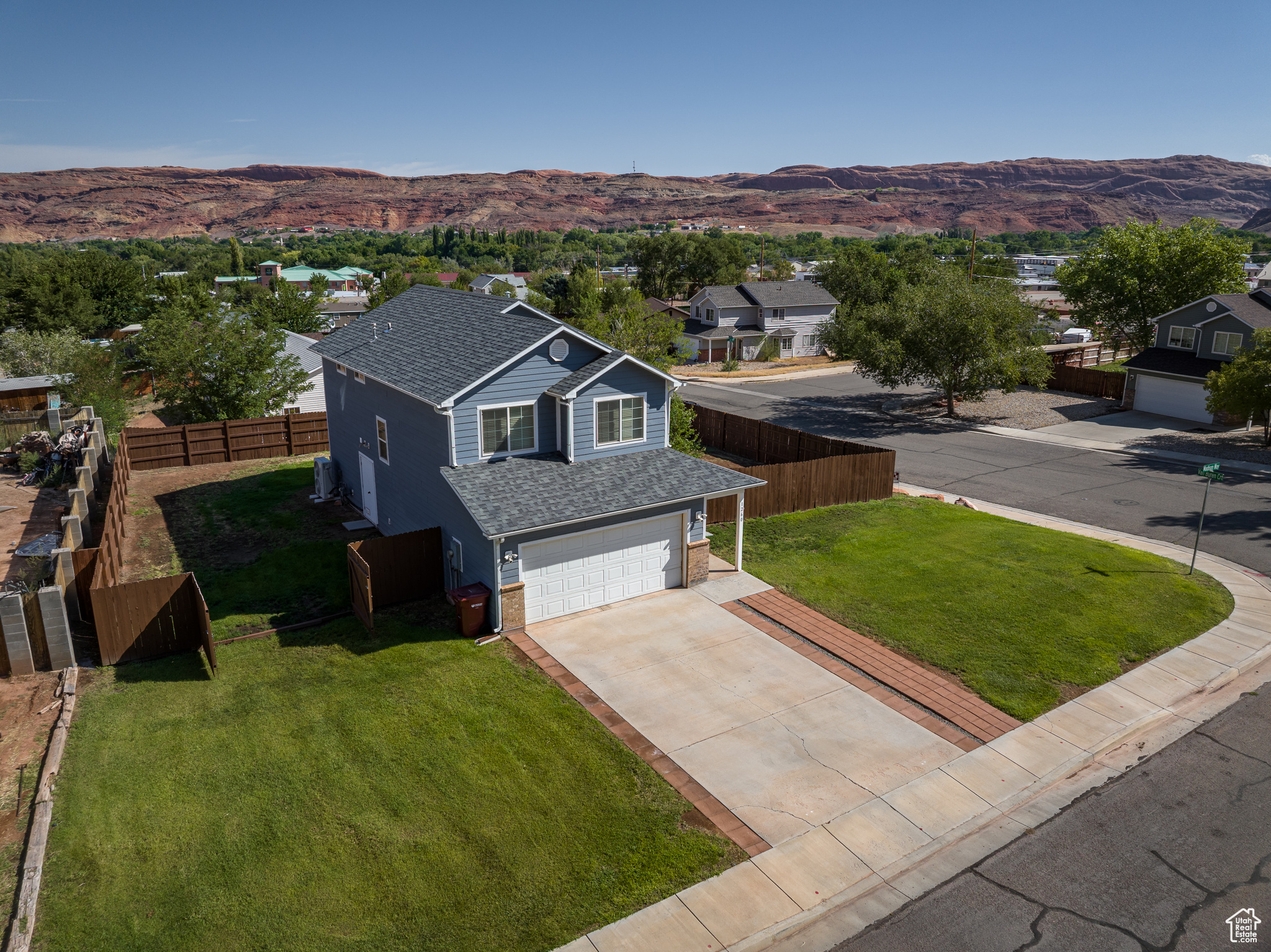 Welcome to Madison Way, a spacious 4-bedroom, 2.5-bathroom home located just outside Moab city limits. Situated on a .21-acre lot, In 2024 this property was upgraded, including a completely new roof, upgraded siding, water heater, and high efficiency central heating and air conditioning. This property also includes a $15,000 flooring allowance. It lies just outside the Moab city limits and as such benefits by having lower taxes while remaining close to all that Moab has to offer. Inside, you'll find a thoughtfully designed layout with ample living space for comfort and functionality. The bedrooms are well-proportioned, and the primary suite includes its own bathroom for convenience. The additional bathrooms serve both family and guests with ease. The outdoor space provides room to enjoy Moab's natural beauty, whether for gardening, entertaining, or simply relaxing. With its location just beyond city limits, this home combines the appeal of a private setting with the accessibility of nearby amenities. This property presents an excellent opportunity to enjoy life in Moab with both space and convenience.