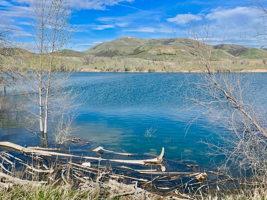 This property is incredible! Lot 1 is waterfront so you can enjoy all the beauty and recreational opportunities that Lamont Reservoir has to offer. The 5.85 acre property has several great spots to build that will give you views of the mountains in every direction. The property is ideal for horses or other animals, and it has plenty of space for a shop or barn. The lot has 499 feet of frontage along Lamont Reservoir. The reservoir is great for fishing, paddleboarding, kayaking, and swimming. The property is close to amazing trails, snowmobiling, hunting, and so much wildlife. It's only a few minutes outside of the town of Preston, ID. The lot has had power stubbed and has passed a PERC test. The buyers will need to drill a well.  Additional land is available. 2200 E (the road leading to the subdivision) will be paved this summer. Owner/Agent.