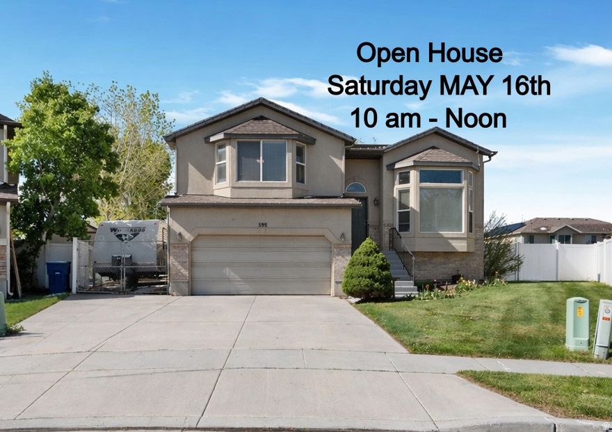 OPEN HOUSE, Saturday May 16th - 10 am to Noon !! Welcome to 595 Banbury Circle, a well-maintained split-level home located in a quiet neighborhood of North Salt Lake with easy access to I-15 and just minutes from downtown Salt Lake City. This home offers a functional and inviting layout with bright, open living spaces and large windows that fill the home with natural light-including beautiful views from the upper level. The main living areas flow seamlessly, creating a comfortable space for both everyday living and entertaining. Downstairs, you'll find a fully finished lower level featuring a spacious family room, additional bedroom, and bathroom-perfect for guests, a home office, or multi-generational living. Private backyard with room to relax or entertain family & friends.  Convenient location near shopping, dining & commuter routes. This home offers the perfect combination of space, flexibility, and location-ideal for homeowners looking for comfort with room to grow. Schedule your showing today and come see all this home has to offer!