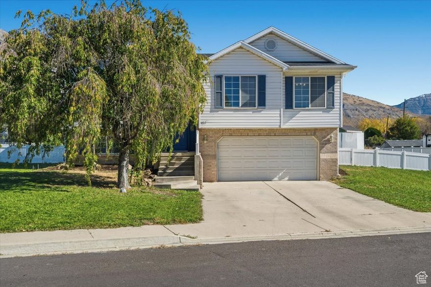 Welcome to this beautifully maintained 4-bedroom, 2-bath split-level home, perfectly situated on a large corner lot in a quiet Pleasant Grove neighborhood. Enjoy breathtaking mountain views and a location that balances peaceful living with convenience - just minutes from shopping, dining, and schools. Step inside to find a bright, welcoming layout with spacious living areas, a functional kitchen, and comfortable bedrooms. The generous yard offers plenty of room to play, garden, or entertain while taking in the scenic surroundings. New water heater, water softener, and reverse osmosis filtration system. New quartz kitchen counters and bathroom vanity. You'll love the friendly neighborhood and easy access to everything Pleasant Grove has to offer - from local parks and trails to quick connections to American Fork and I-15.