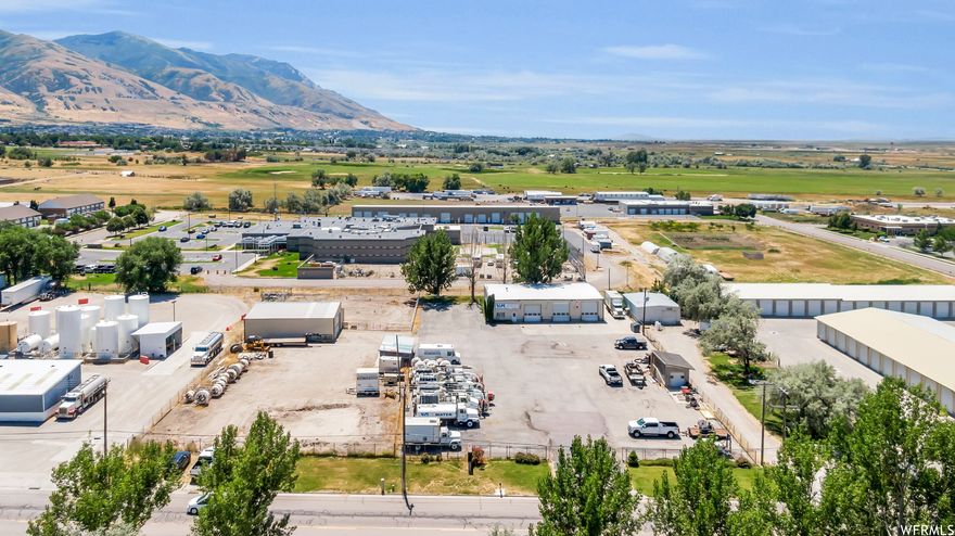 Million dollar price drop!!!!!    It's time to retire!  Industrial Building and utility maintenance & repair company included in the sale. (Real Estate is included in the asking price.)   This successful business is a sewer rehabilitation contracting company that specializes in cleaning, inspections and repair of sewer and storm drain pipes in addition to potholing for utilities.  The company has state of the art equipment,  multiple specialized trucks (18 company trucks total) for this type of business and they are an exclusive installer for fold and form PVC alloy pipe liner. No other service providers are authorized to use the same materials and service methods. They can line sewers, storm drains, or culverts ranging in sizes from 6 inches to 36 inches.  The company works on exclusive private company contracts  as well as state contracts with UDOT directly as well as large construction companies, city, county and state contracts.  The business sale consists of Equipment, trade tools, (FF&E) Trade name, and contracts.  The owner is willing to stay on as an employee, consultant, contractor or some combination as well as the office manager (for a limited and negotiated time frame) to help train the new owners to make the transition smooth for employees, bid jobs as well as for the customers.  The facility is a 4600 sq ft shop with three (3) 16 ft bays, an office, a conference room, a store room, bathroom and a tool and maintenance room located on 1 full acre yard.  Plenty of room to park the large trade trucks, semi trucks and store inventory.   Both business and building sold together.   Square footage figures are provided as a courtesy estimate only and were obtained from county records.  Buyer is advised to obtain an independent measurement.